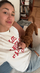 Woman films video with poodle in Montenegro apartment