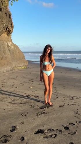 Woman enjoys morning beach time in Tabanan, Indonesia