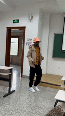 Man dances with phone in empty Beijing classroom