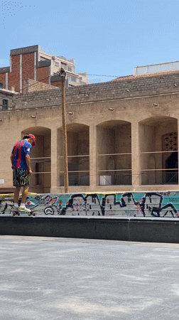 Skateboarding tricks session in Barcelona urban plaza