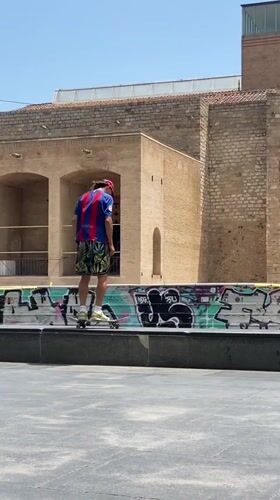 Skateboarding tricks session in Barcelona urban plaza