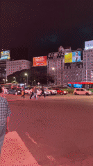 Nighttime street life captured around Buenos Aires Obelisco