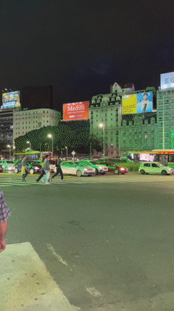 Nighttime street life captured around Buenos Aires Obelisco