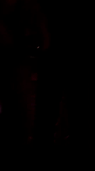 Person silhouetted against chain curtains in Tbilisi nightclub