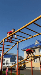 Children play on playground equipment in Chaikovsky, Russia