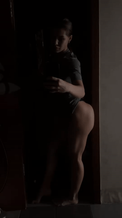 Woman takes selfie in doorway, Irkutsk, early morning