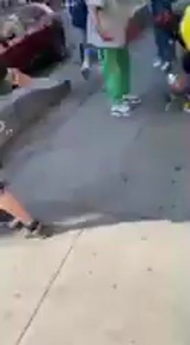 Man on ground draws crowd on NYC sidewalk
