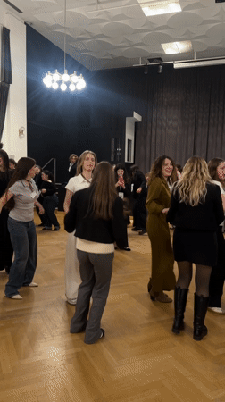 Young women dance in Strasbourg venue with wooden floors