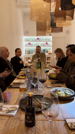 Group dinner featuring Italian cuisine captured at Ibiza restaurant