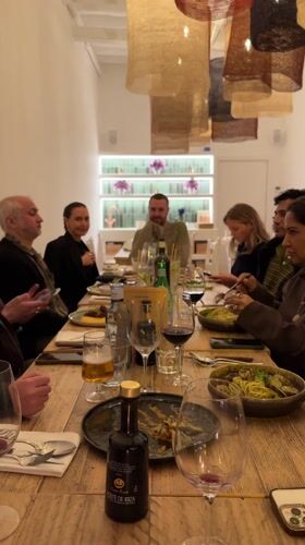 Group dinner featuring Italian cuisine captured at Ibiza restaurant