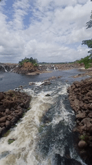 Turbulent river and dramatic waterfall documented by witness