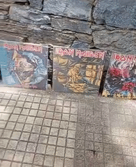 Heavy metal vinyl collection displayed on Caracas street wall