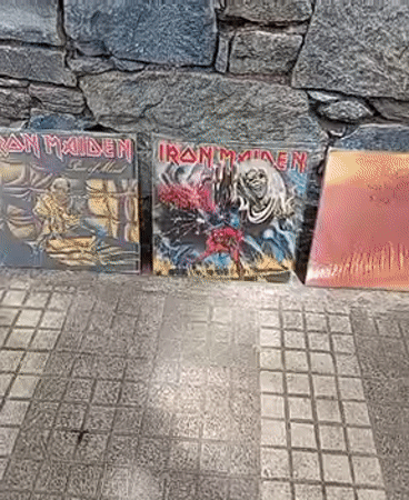 Heavy metal vinyl collection displayed on Caracas street wall