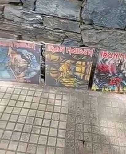 Heavy metal vinyl collection displayed on Caracas street wall