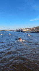 Passenger boats navigate Saint Petersburg river under sunny skies