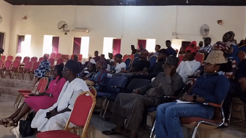 Crowd gathered in tiered hall for event in Barden Yana