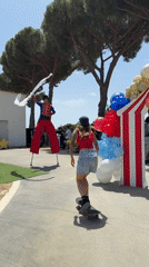 Circus-themed birthday party with stilt walkers and street performers