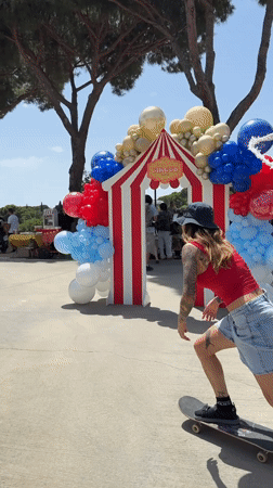Circus-themed birthday party with stilt walkers and magic show