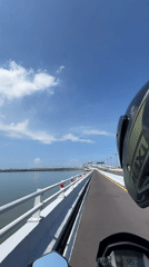 Routine traffic filmed on Bali Mandara Toll Road bridge