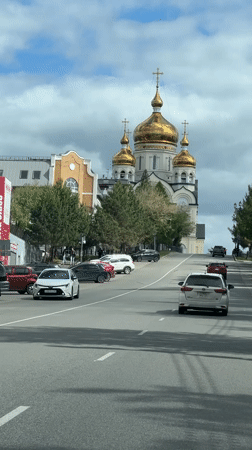 Traffic flows past Orthodox church in Khabarovsk