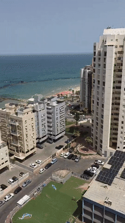 Aerial footage captures morning beach scene in Bat Yam