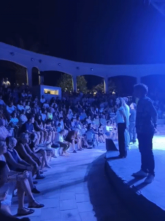 Outdoor amphitheater show lights up a Kuşadası night