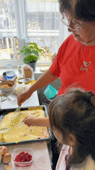 Woman and girl bake together in Abzakovo kitchen