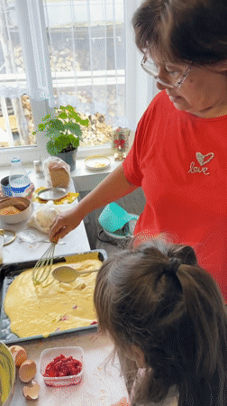 Woman and girl bake together in Abzakovo kitchen