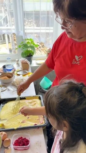 Woman and girl bake together in Abzakovo kitchen