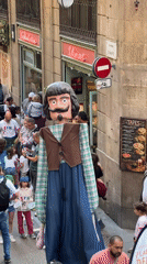 Costumed parade with giant figures draws crowds in Barcelona