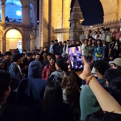 Nighttime crowd gathers in Arequipa public square