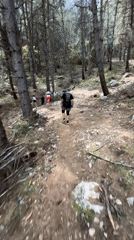 Group walks forest trail in Fethiye, Turkey
