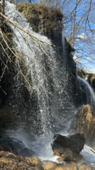 Tourist documents waterfalls and monastery in Ribaritsa, Bulgaria
