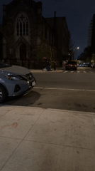Nissan SUV parked on New York street during nighttime