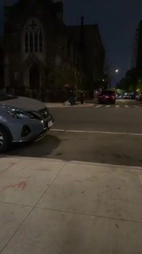 Nissan SUV parked on New York street during nighttime