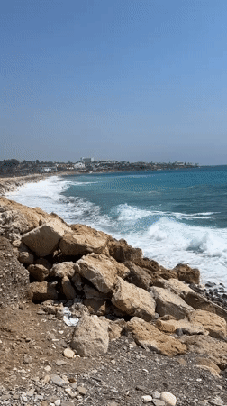 Turquoise waves and rocky shores along the Kissonerga coastline