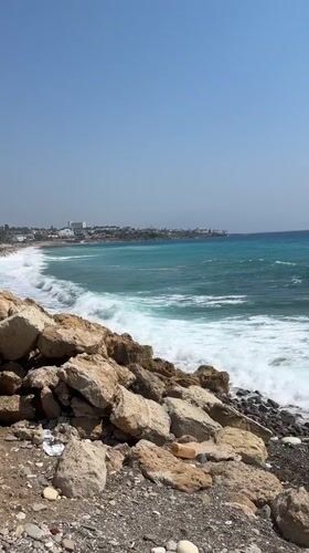 Turquoise waves and rocky shores along the Kissonerga coastline