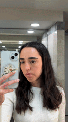 Woman Takes Bathroom Selfies While Applying Mascara