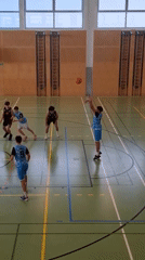 Young basketball players compete in Vienna gymnasium