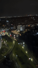 Aerial nighttime view captures Sofia highways and cityscape