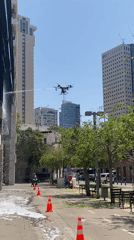 Commercial drones clean Tel-Aviv high-rise facades in daylight operation