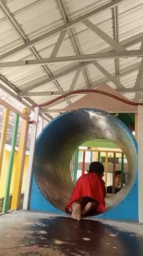 Morning playground and backyard scenes in Sumbersari, Indonesia