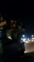 Evening street vendors and transport activity documented in Ikeja