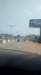 In-vehicle footage spanning highway and busy street scenes