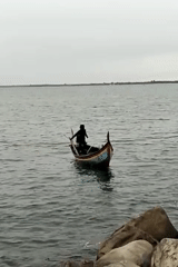 Colorful wooden boat rowing off the Lhokseumawe coast