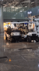 Airport transit with wine bar, golf carts, and AZjet on tarmac