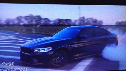 BMW performs burnout on divided road amid rural setting