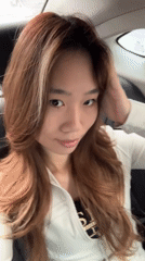 Woman takes selfie in car backseat in Liangjiang