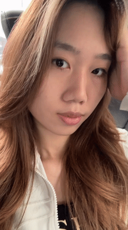 Woman takes selfie in car backseat in Liangjiang
