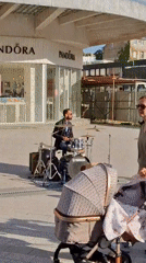 Street drummer performs in Novi Sad plaza draws pedestrians